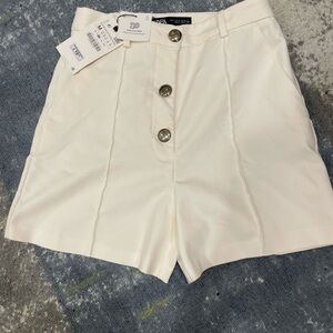 Off white Zara shorts with silver buttons